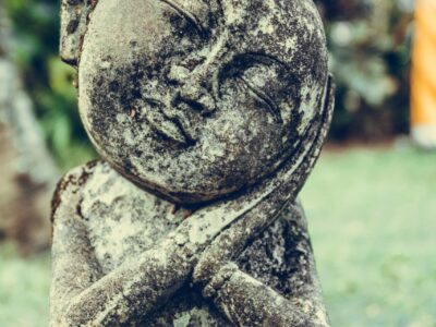 selective focus photography of statue